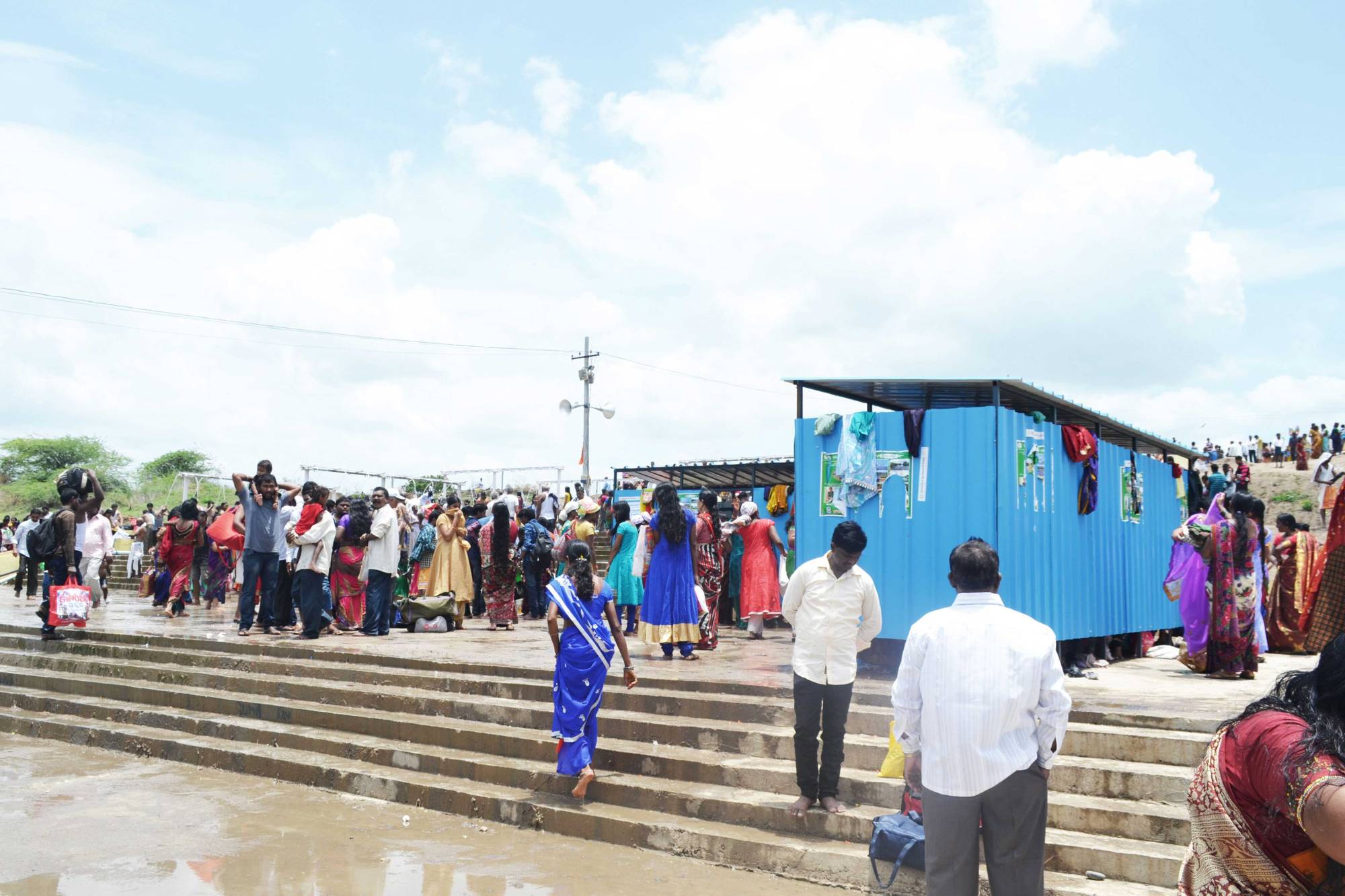 Temporary steel structures serve as changing rooms.