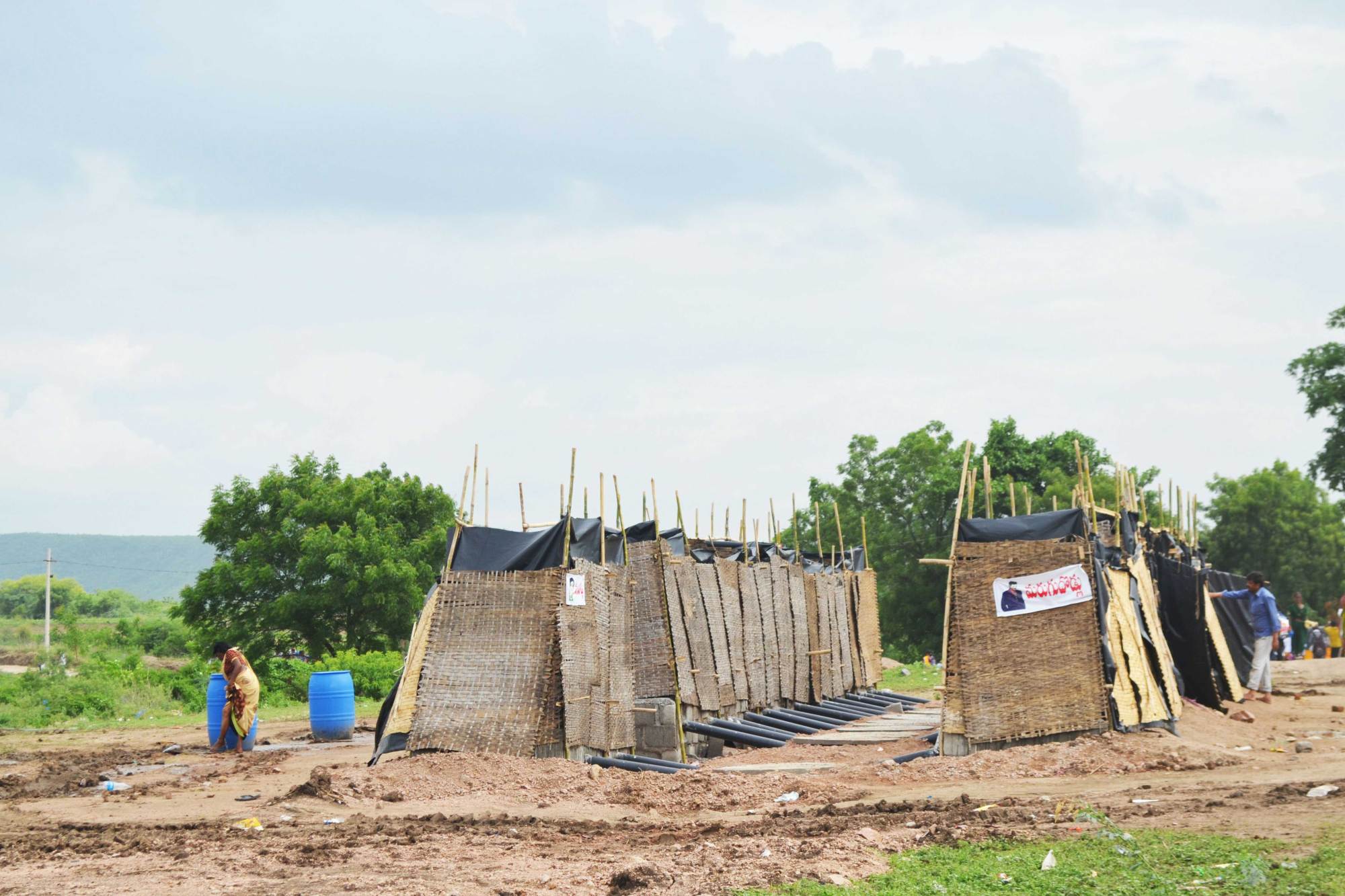 Bamboo structures serve as toilets.
