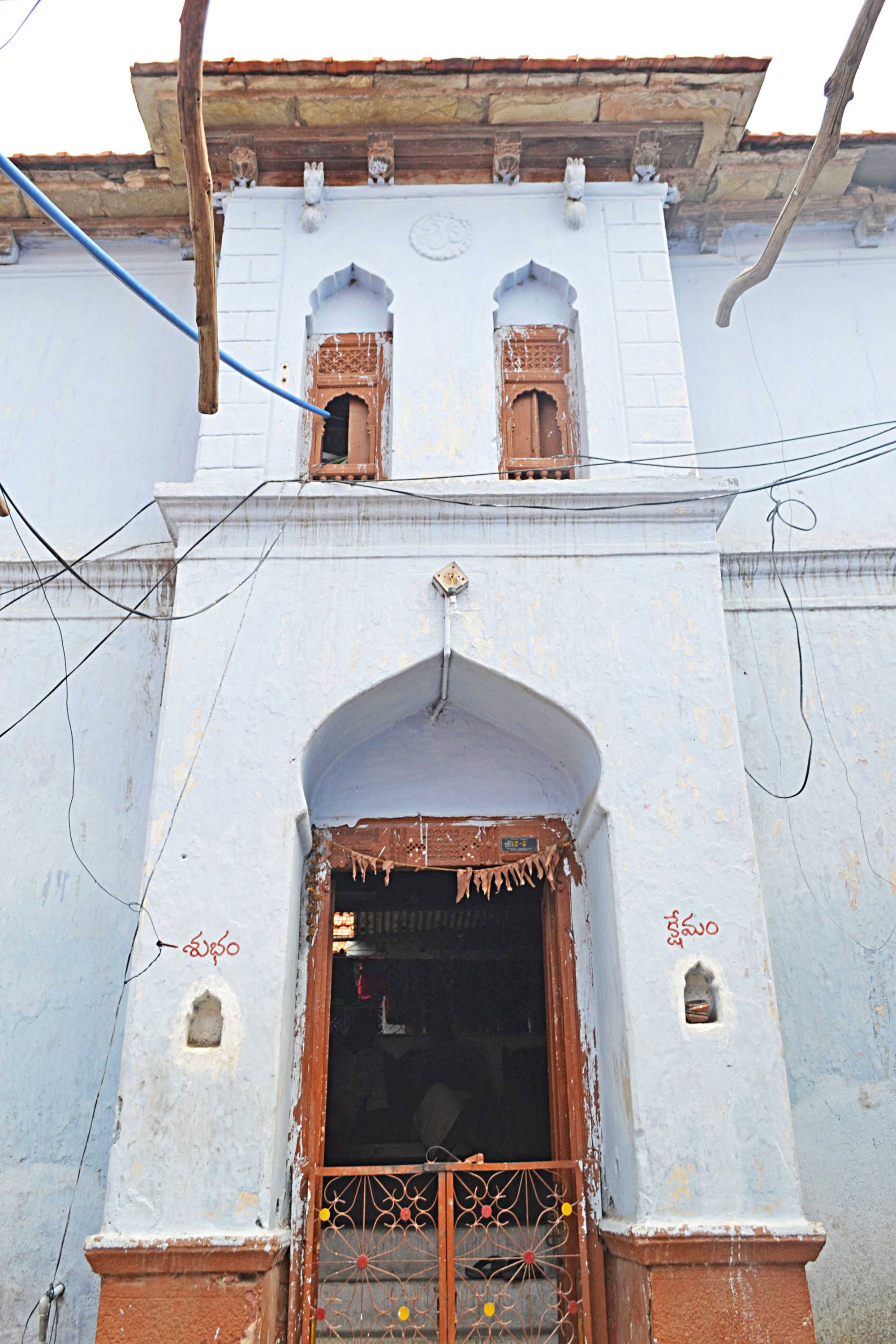 Most double storied houses have a projected entrance portal that also frames steps leading into the house.